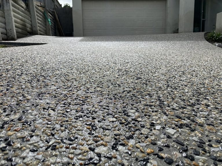 exposed aggregate driveway cost Cairns charcoal and cream pebble blend